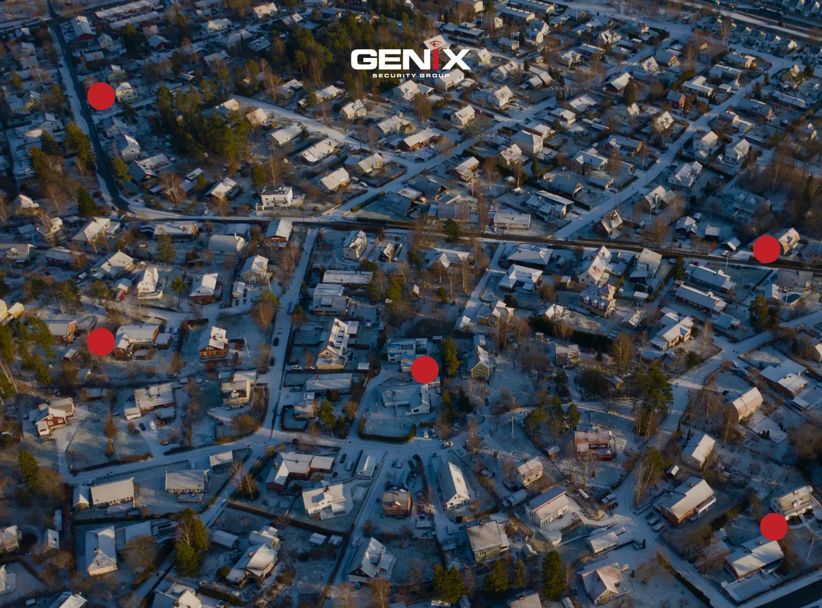 Vue aérienne d’un quartier résidentiel enneigé avec plusieurs points rouges indiquant des zones à risque de cambriolage.